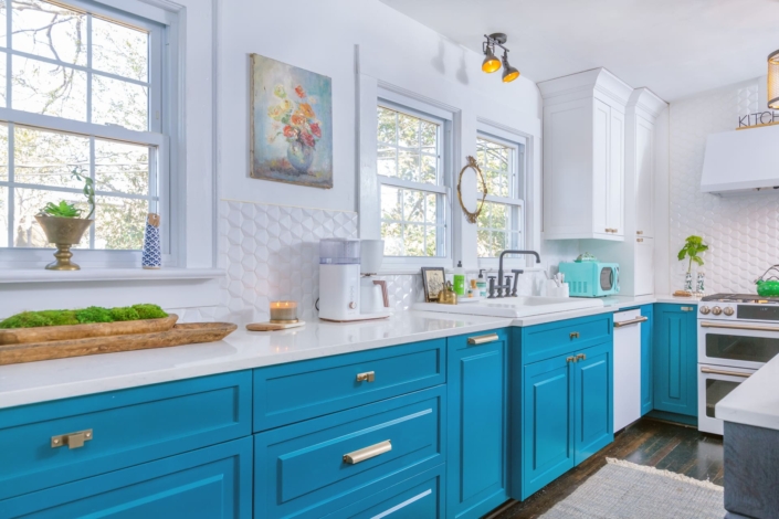 teal kitchen with large windows