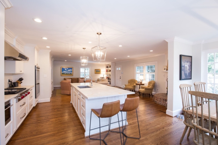 white kitchen and dining room with windows