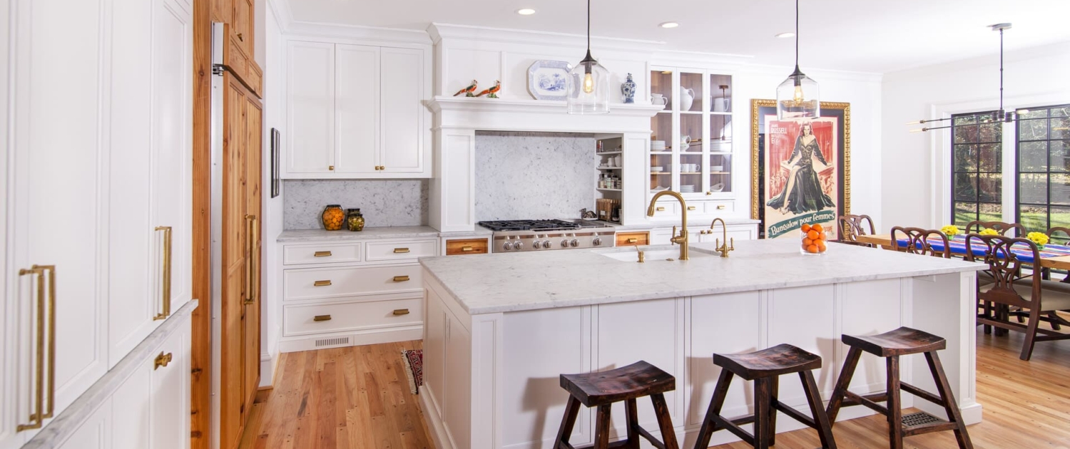 white kitchen with paneled appliances