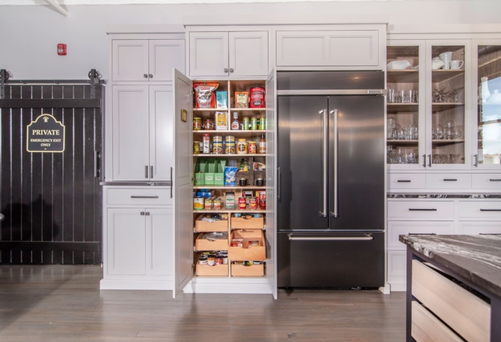 white kitchen with pantry storage