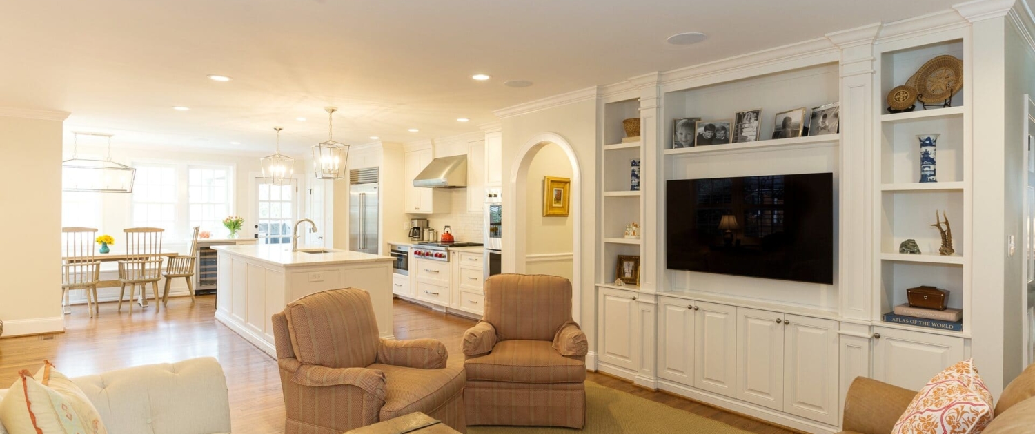 living room and kitchen with a large entertainment center