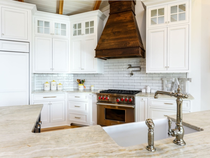 white kitchen with a walnut hood