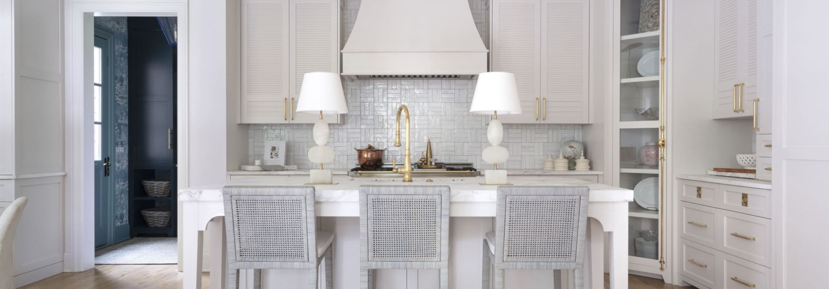 white kitchen with lamps