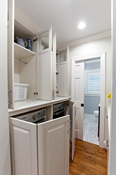 laundry room with cabinet doors