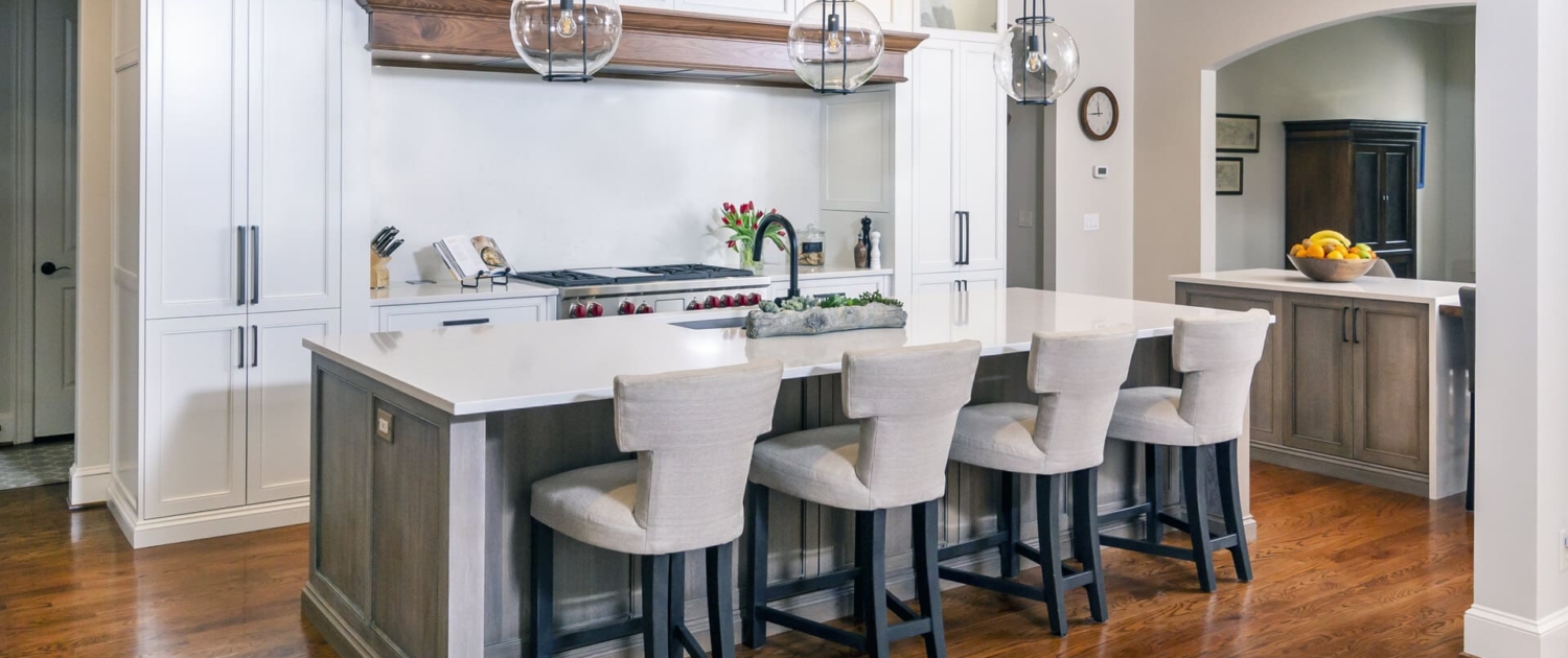 double kitchen island with seating and lights