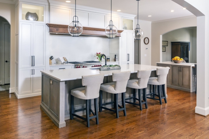 double kitchen island with seating and lights