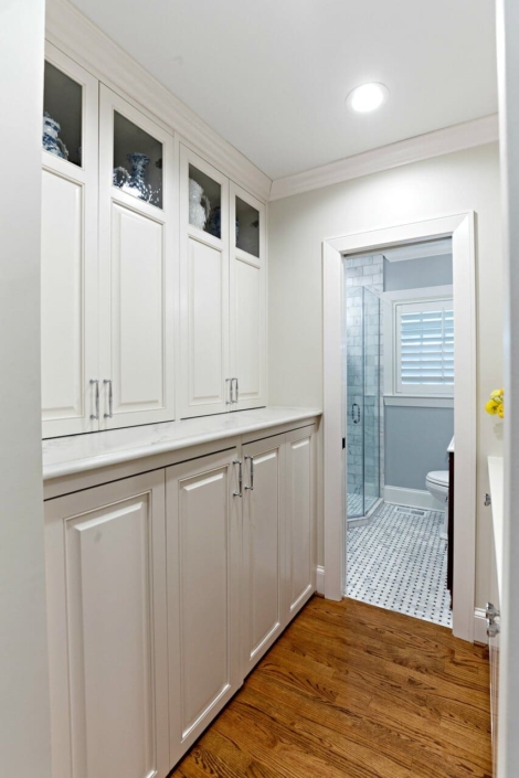 laundry room with a hidden washer and dryer