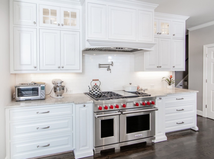 white kitchen with a large range