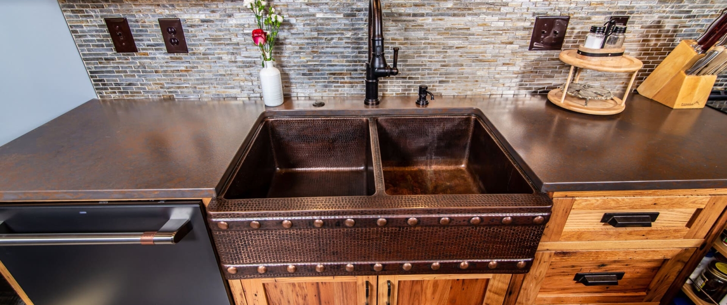 chesnut kitchen with a copper sink