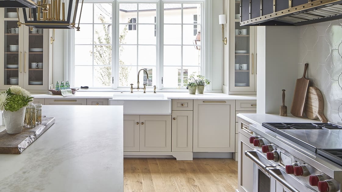 kitchen with large windows and beige cabinets