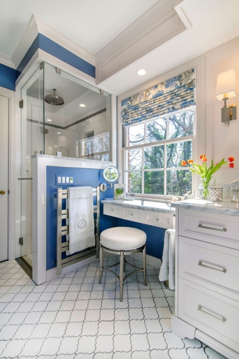 white and blue bathroom with tile flooring