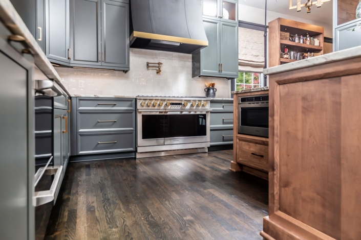 blue kitchen and hardwood floors