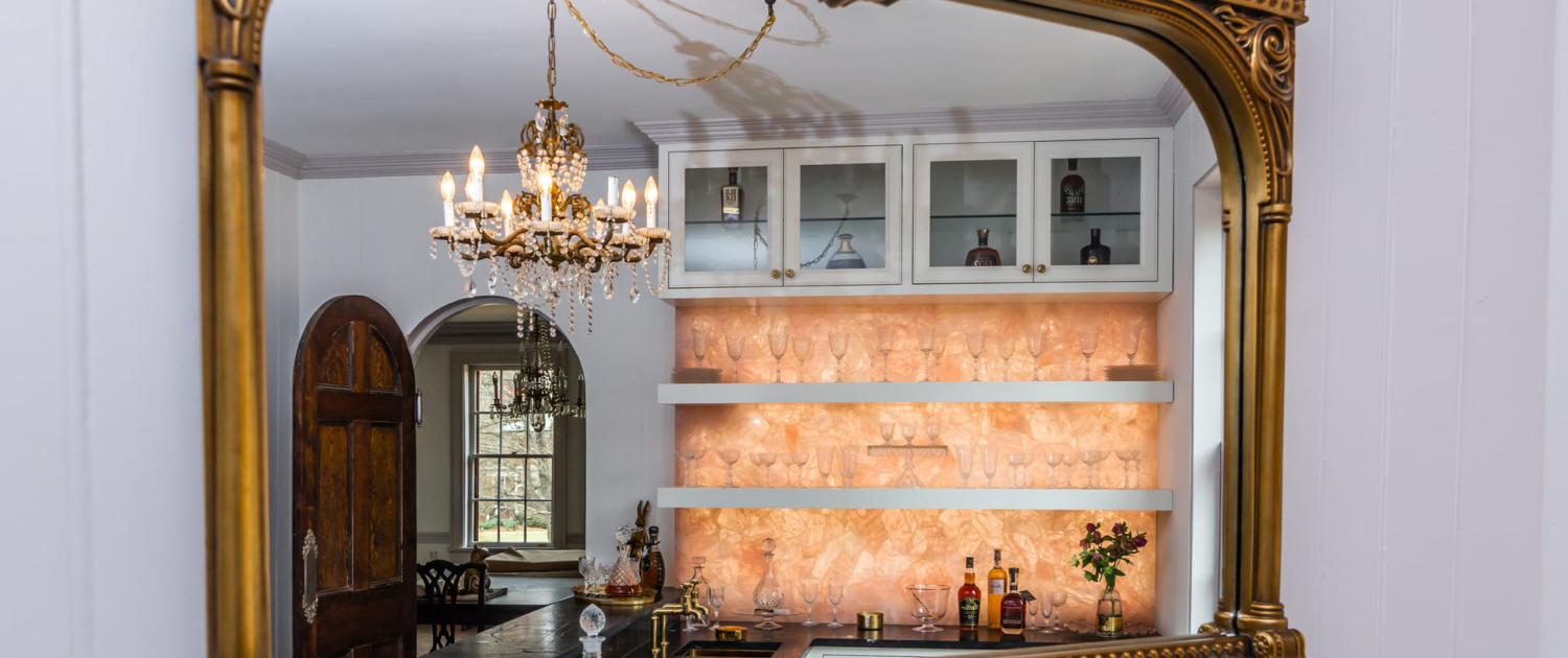 mirror reflecting bar and chandelier