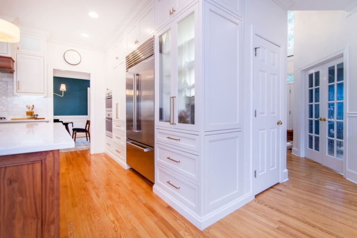 white kitchen with glass doors