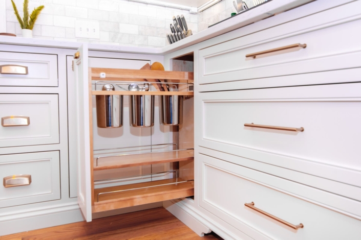 white kitchen with utensil drawer