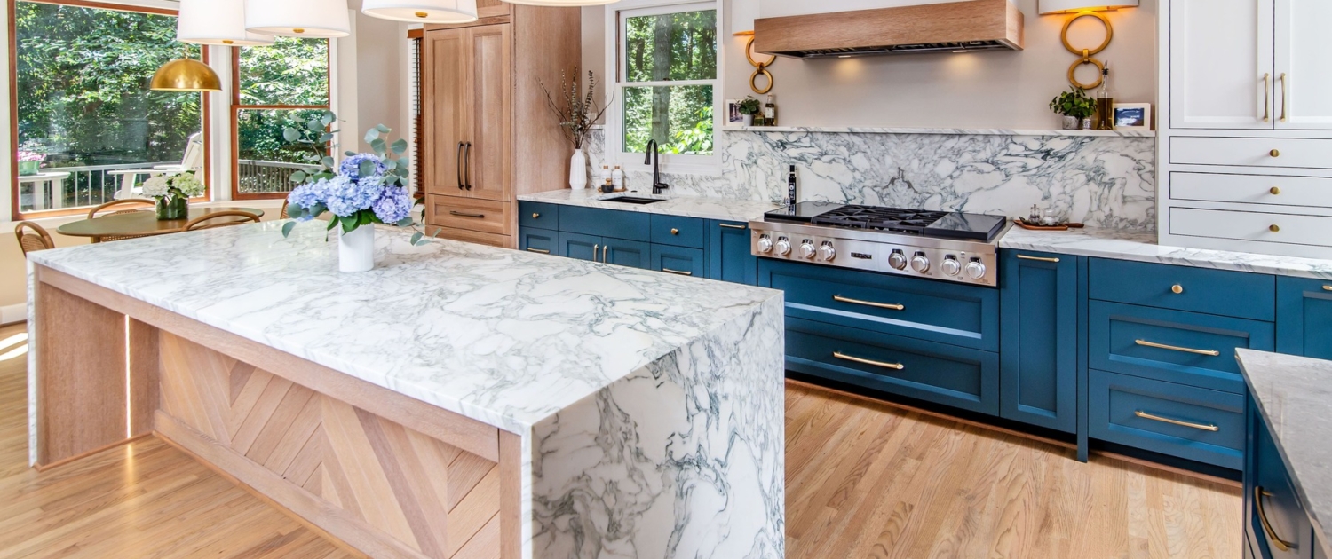 Custom cabinets with marble countertops and backsplash