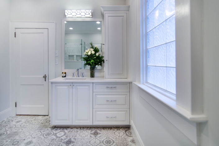 white bathroom with a large window