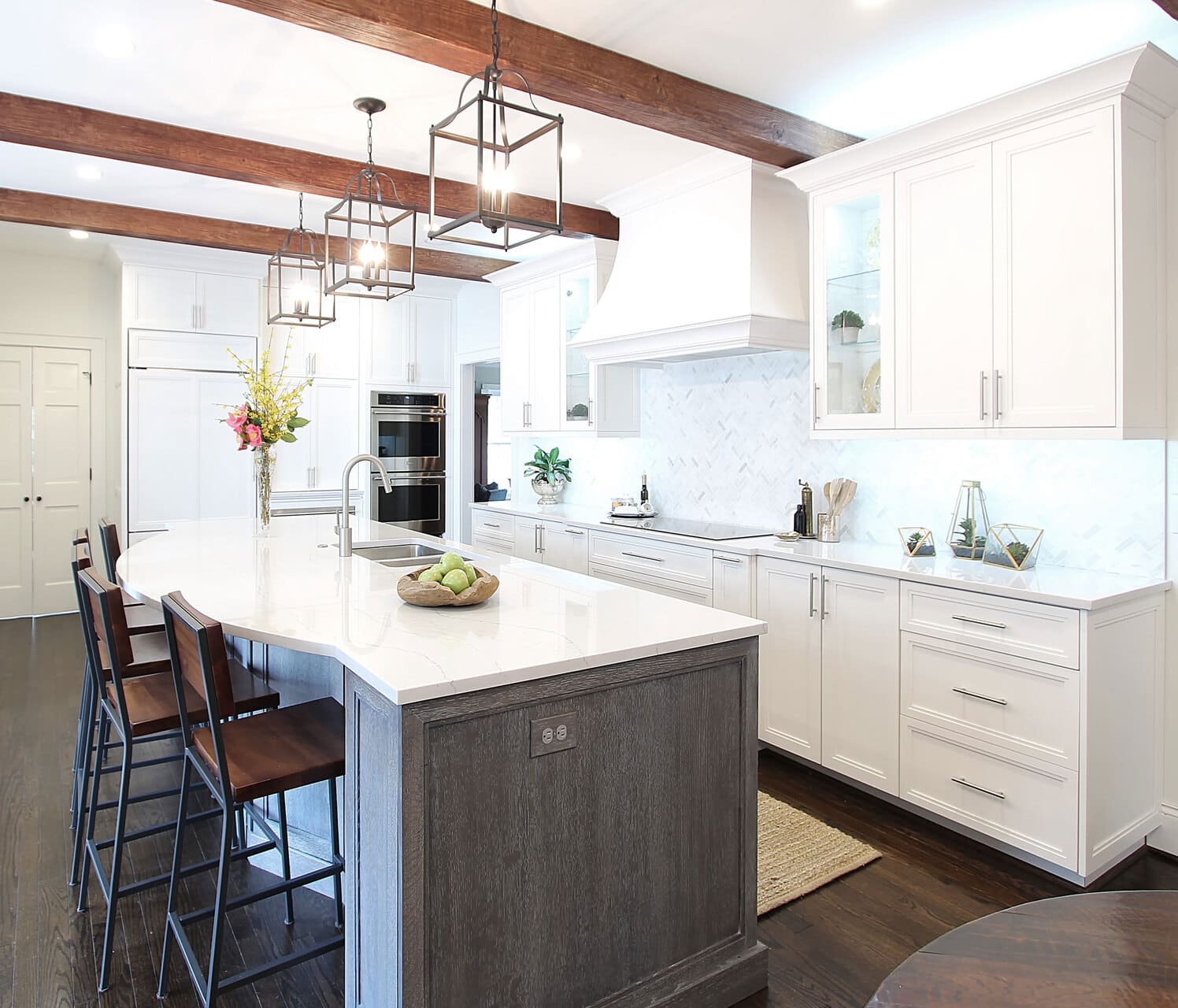 white kitchen with wooden ceiling beams