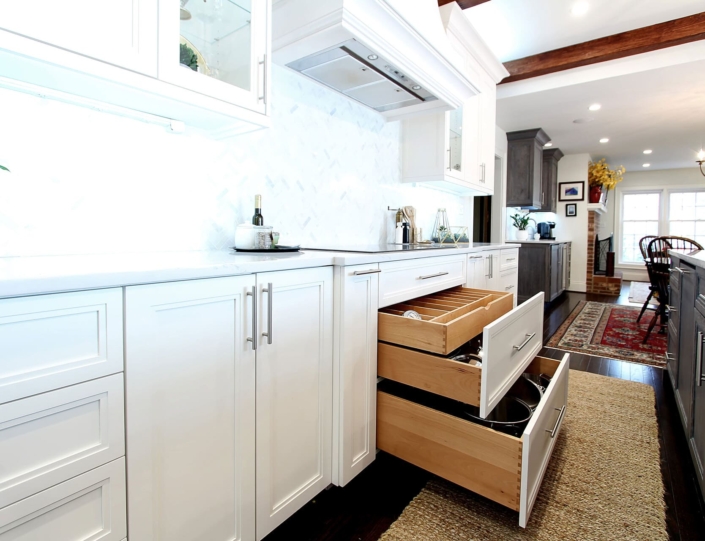 white kitchen cabinets with storage drawers