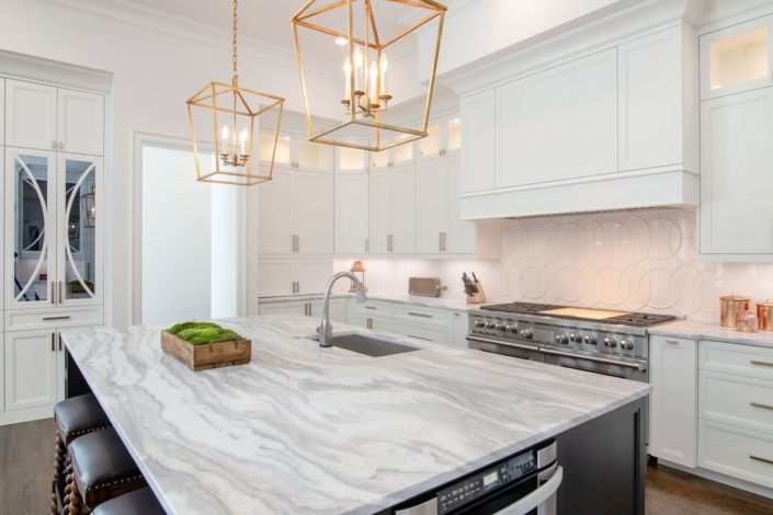 white kitchen with a black island
