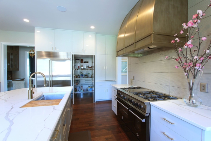 kitchen with flowers and a hidden pantry