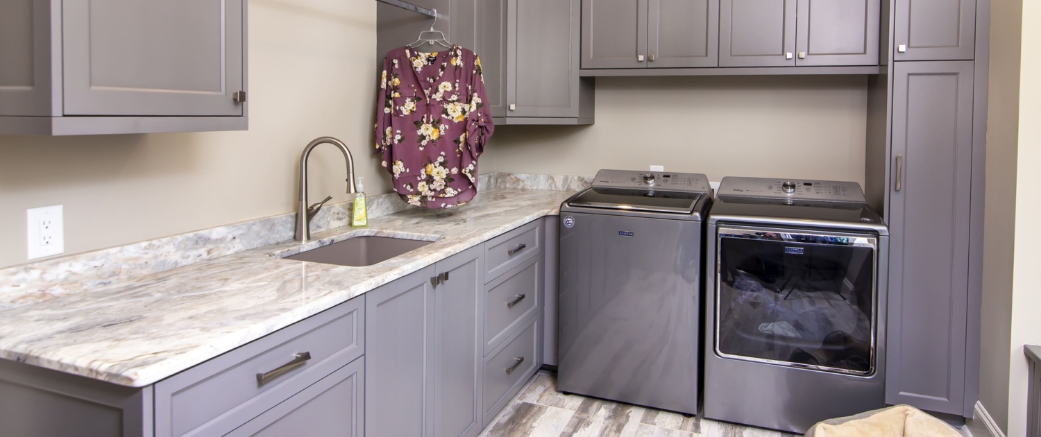 Laundry room with a washer and dryer and hanging space