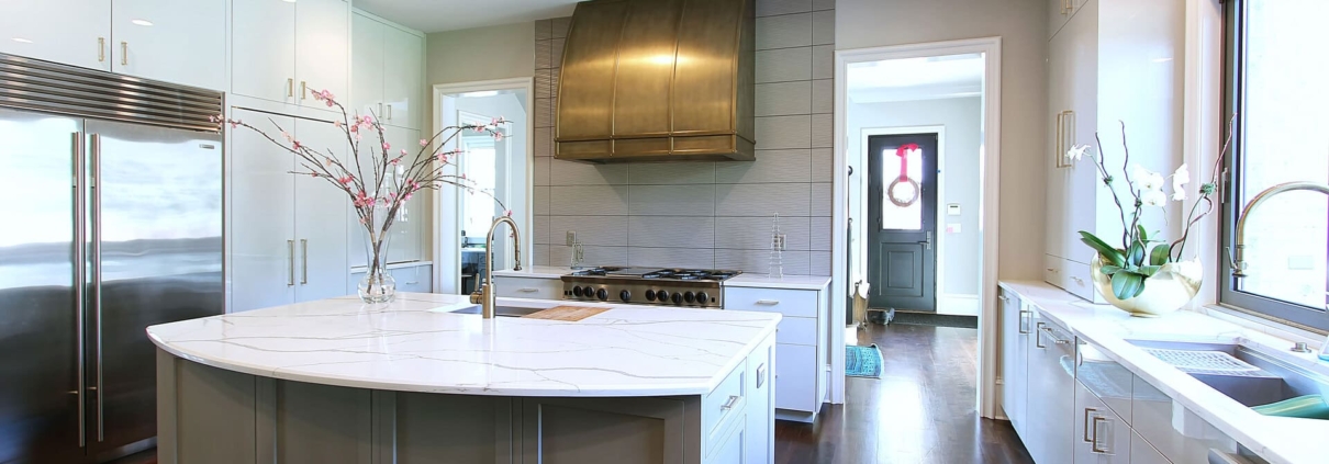 white modern kitchen with a gold hood