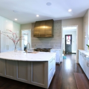 white modern kitchen with a gold hood