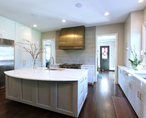 white modern kitchen with a gold hood