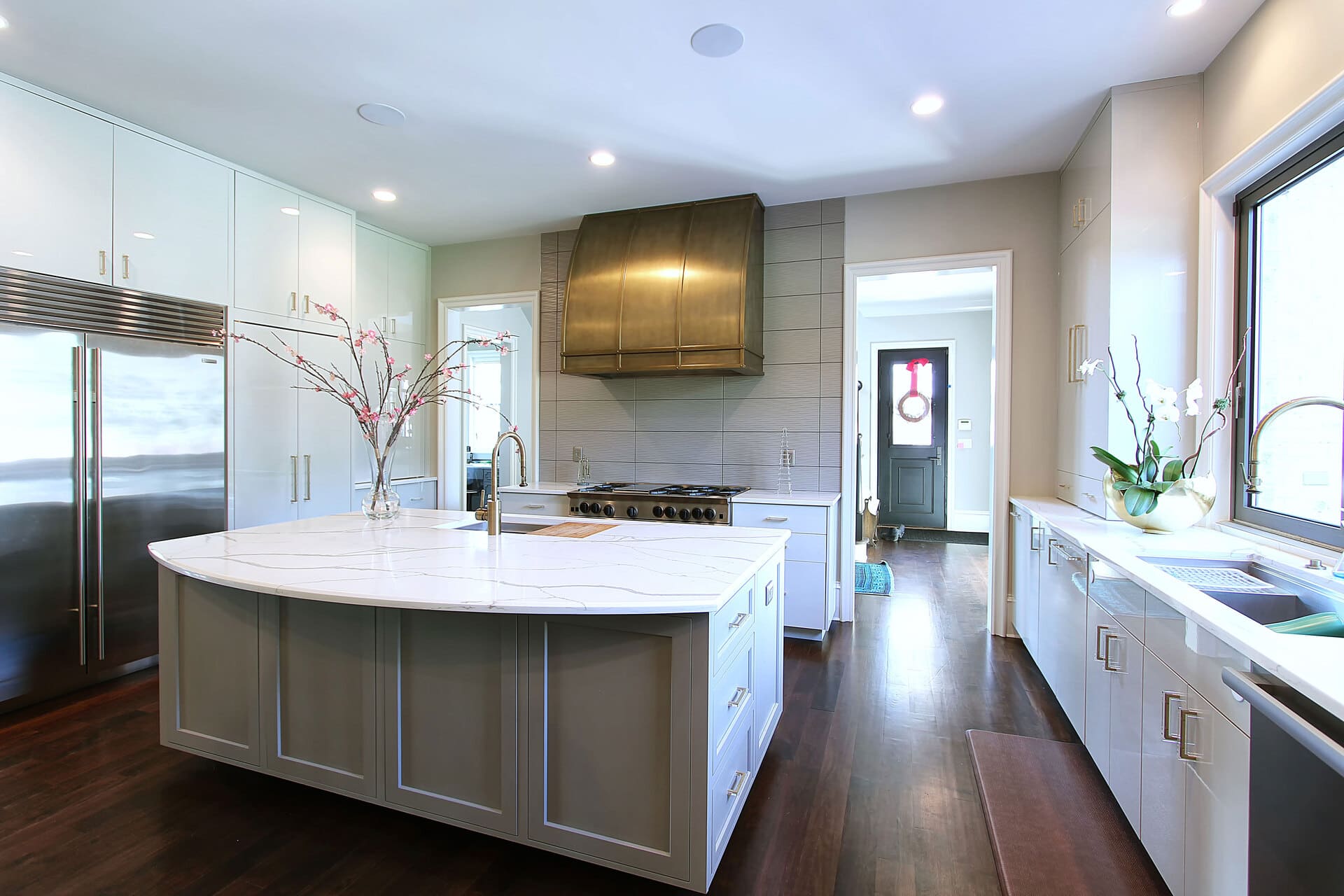 white modern kitchen with a gold hood