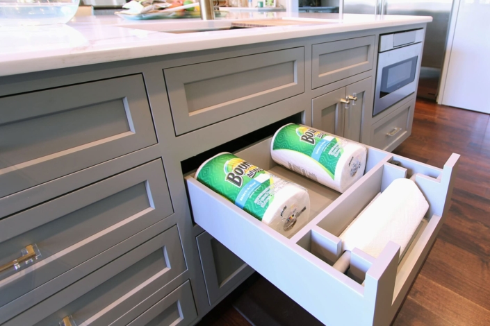 grey island with a paper towel holder