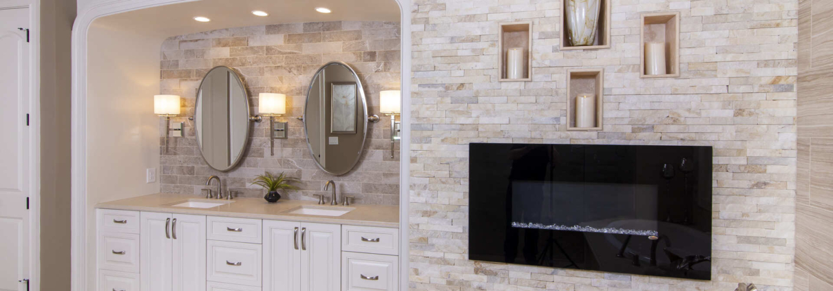 Bathroom with a double vanity and fireplace