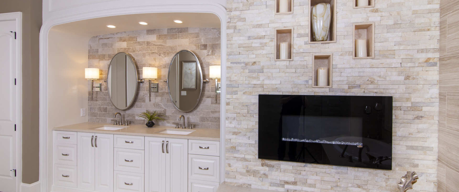 Bathroom with a double vanity and fireplace