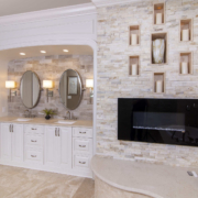 Bathroom with a double vanity and fireplace