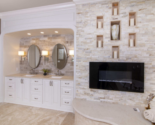 Bathroom with a double vanity and fireplace