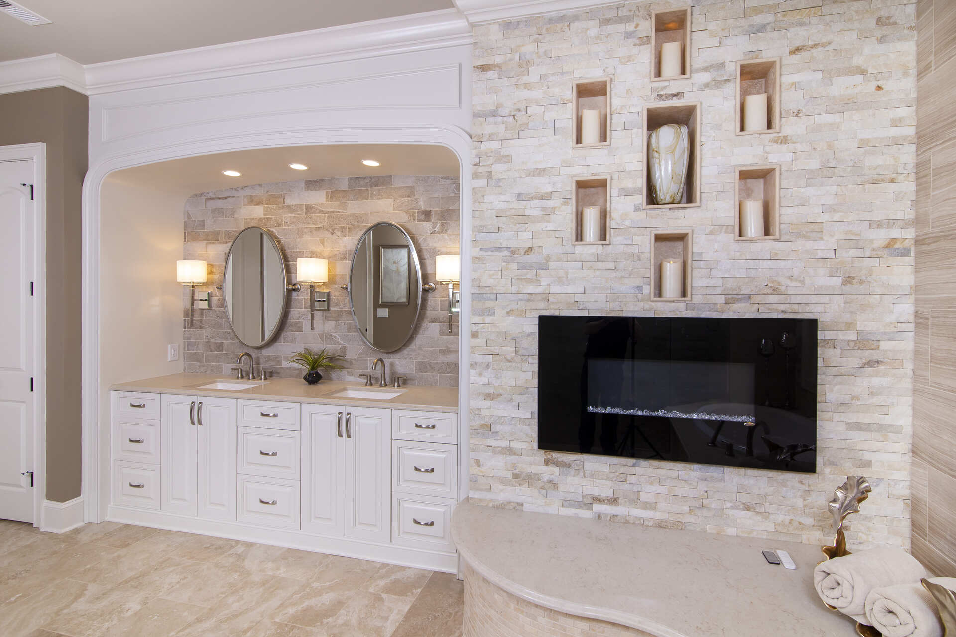 Bathroom with a double vanity and fireplace