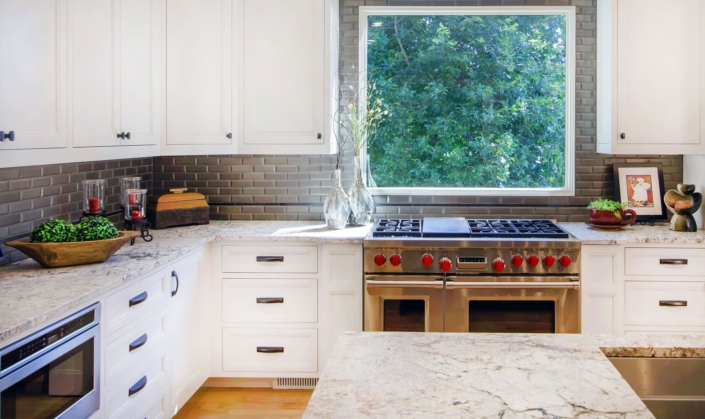 kitchen with flowers and a window