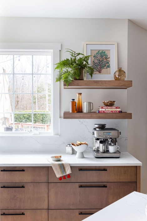 kitchen with floating shelves and a window