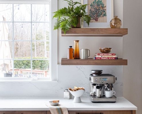 kitchen with floating shelves and a window