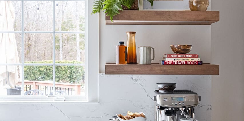 kitchen with floating shelves and a window