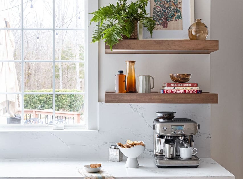 kitchen with floating shelves and a window